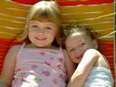 [Two daughters in a lawn chair, summer 2002]